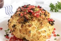 Showstopper Roasted Cauliflower with Garlic Herbs and Pomegranate Burst