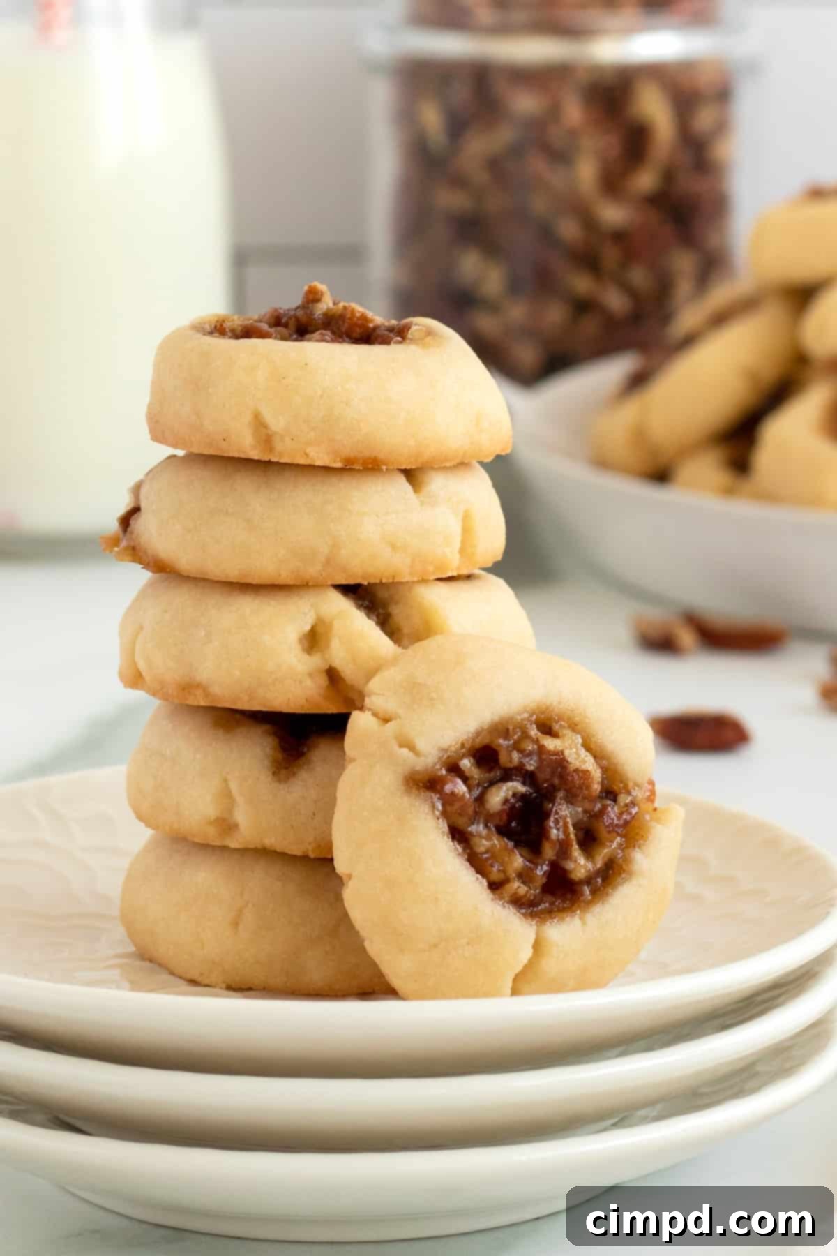 Close-up of a Pecan Pie Thumbprint Cookie showing the gooey filling.