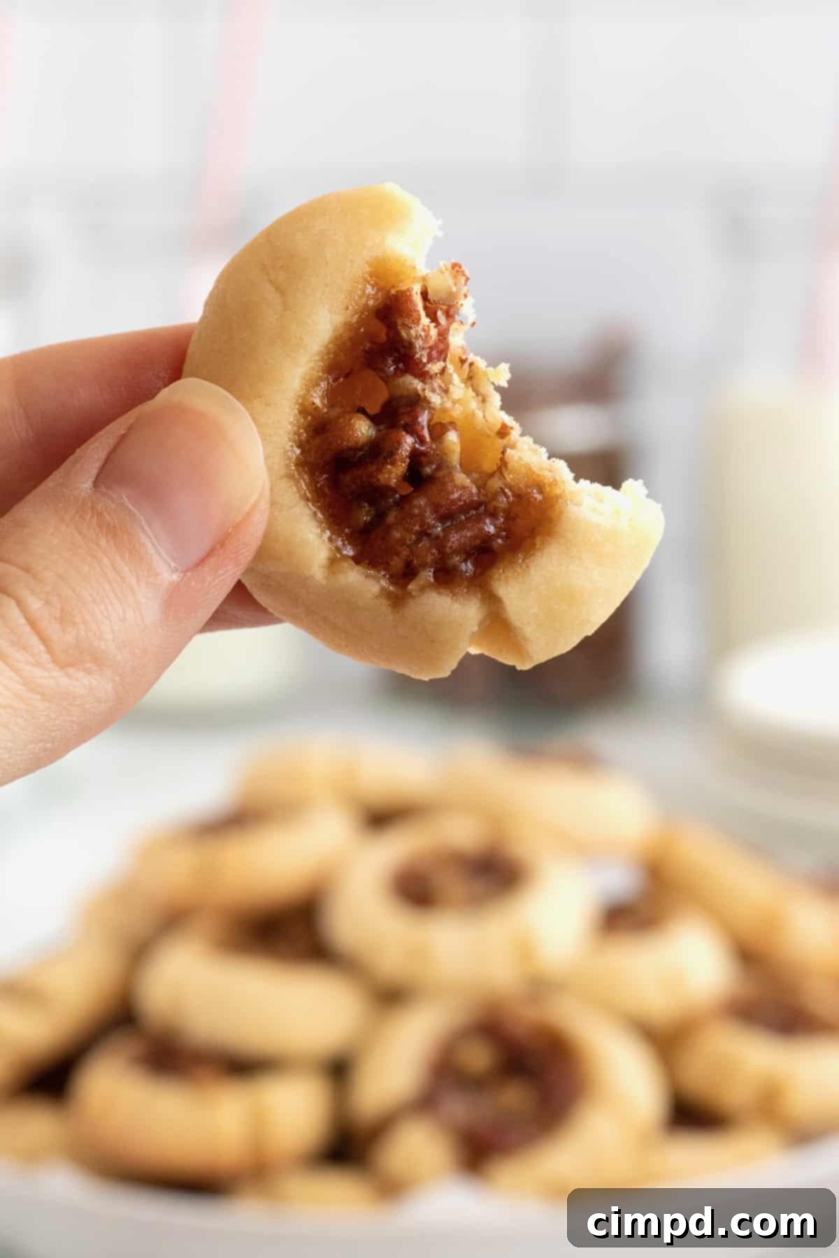 A festive spread of Pecan Pie Thumbprint Cookies for the holidays.