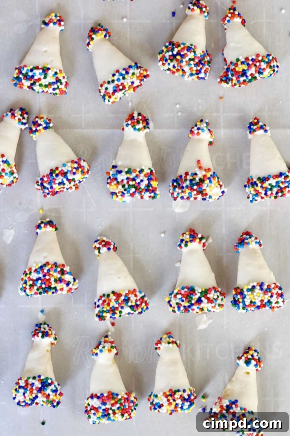 Several finished Birthday Hat Bugles arranged neatly, showcasing their vibrant colors