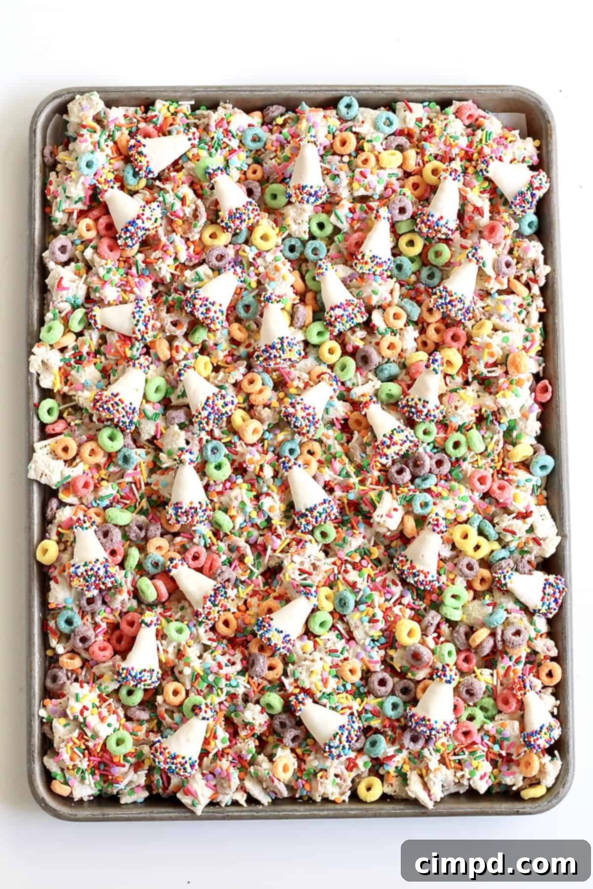 Birthday Bash Blend 5 Birthday Snack Mix cooling on parchment paper