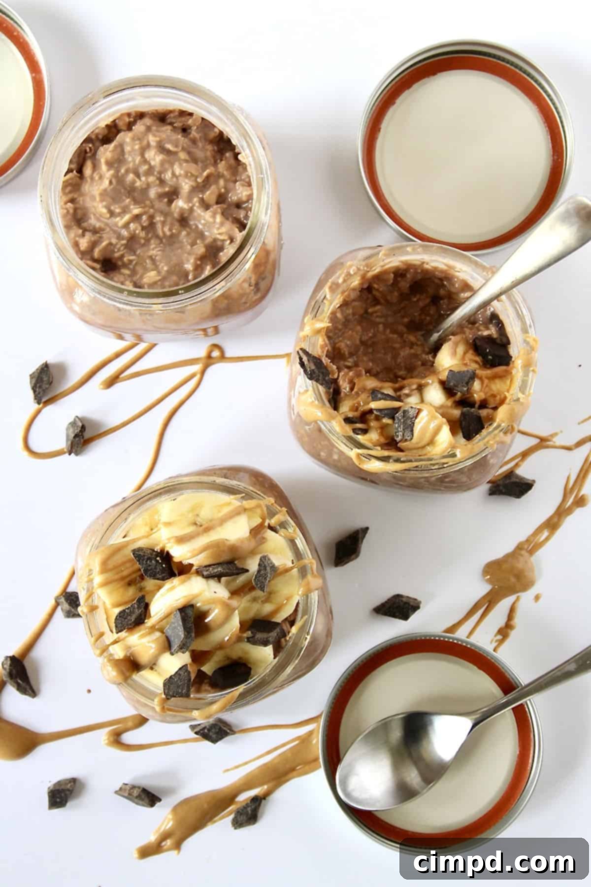 Power-Packed Chocolate Peanut Butter Banana Overnight Oats 8 A person enjoying a jar of Chocolate Peanut Butter Banana Protein Overnight Oats