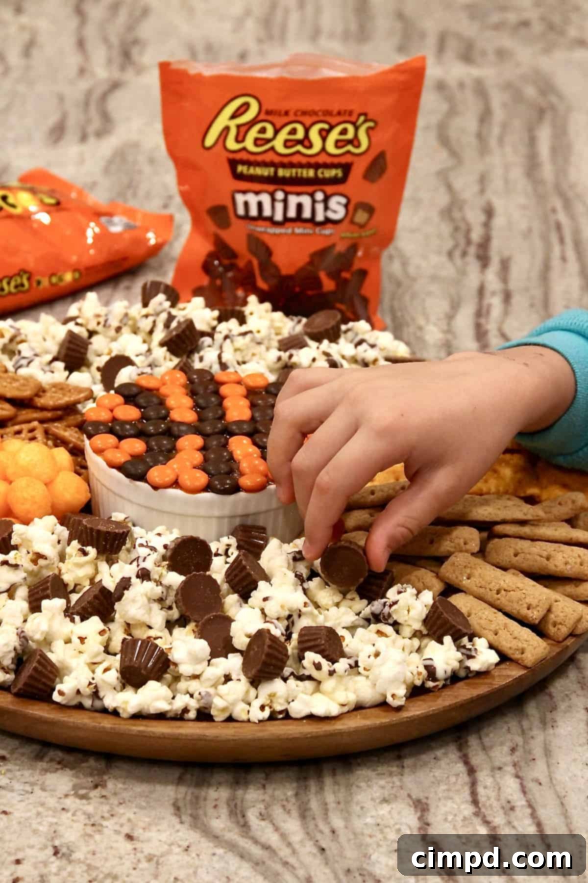 Variety of snacks on the basketball themed board for game day