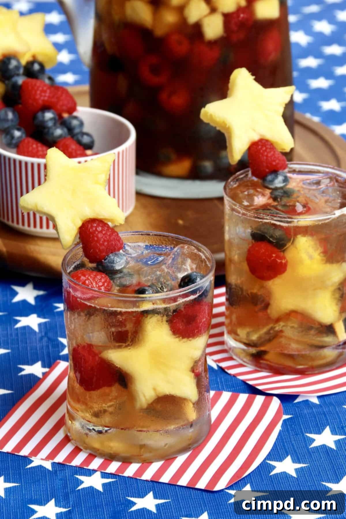 Sparkling Sweet Tea Sangria garnished with star-spangled fruit kabobs.