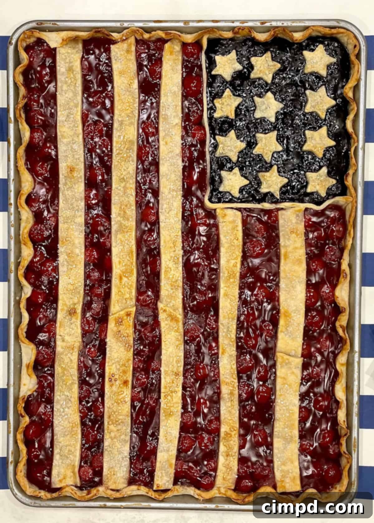 A stunning American Flag Pie filled with berries, showcasing patriotic colors.