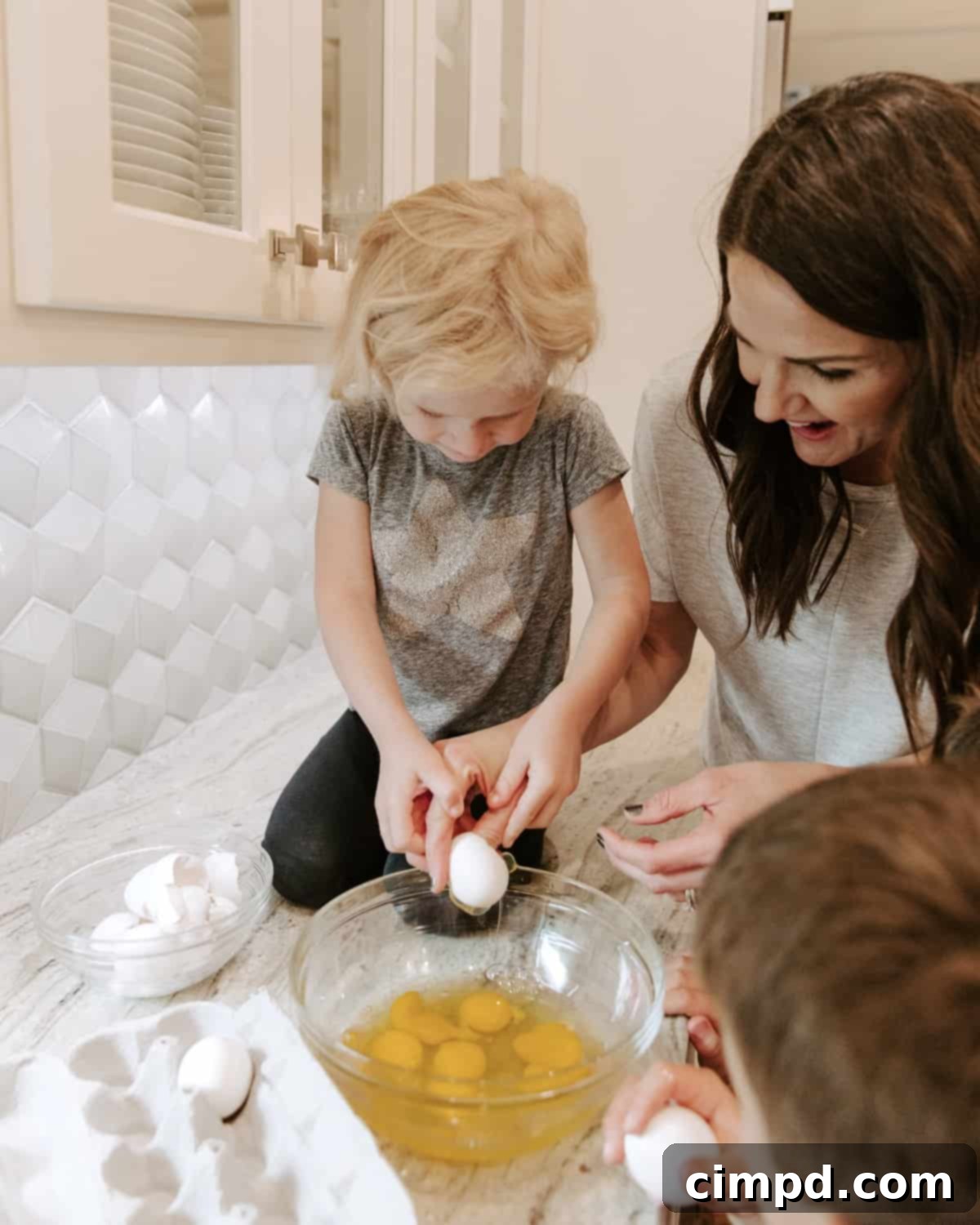 Family gathered around the kitchen island, enjoying Sunday breakfast preparation