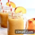 Frozen Peach Tea Bliss 9 Delicious Peach Tea Slushie served in a glass, perfect for a refreshing treat.