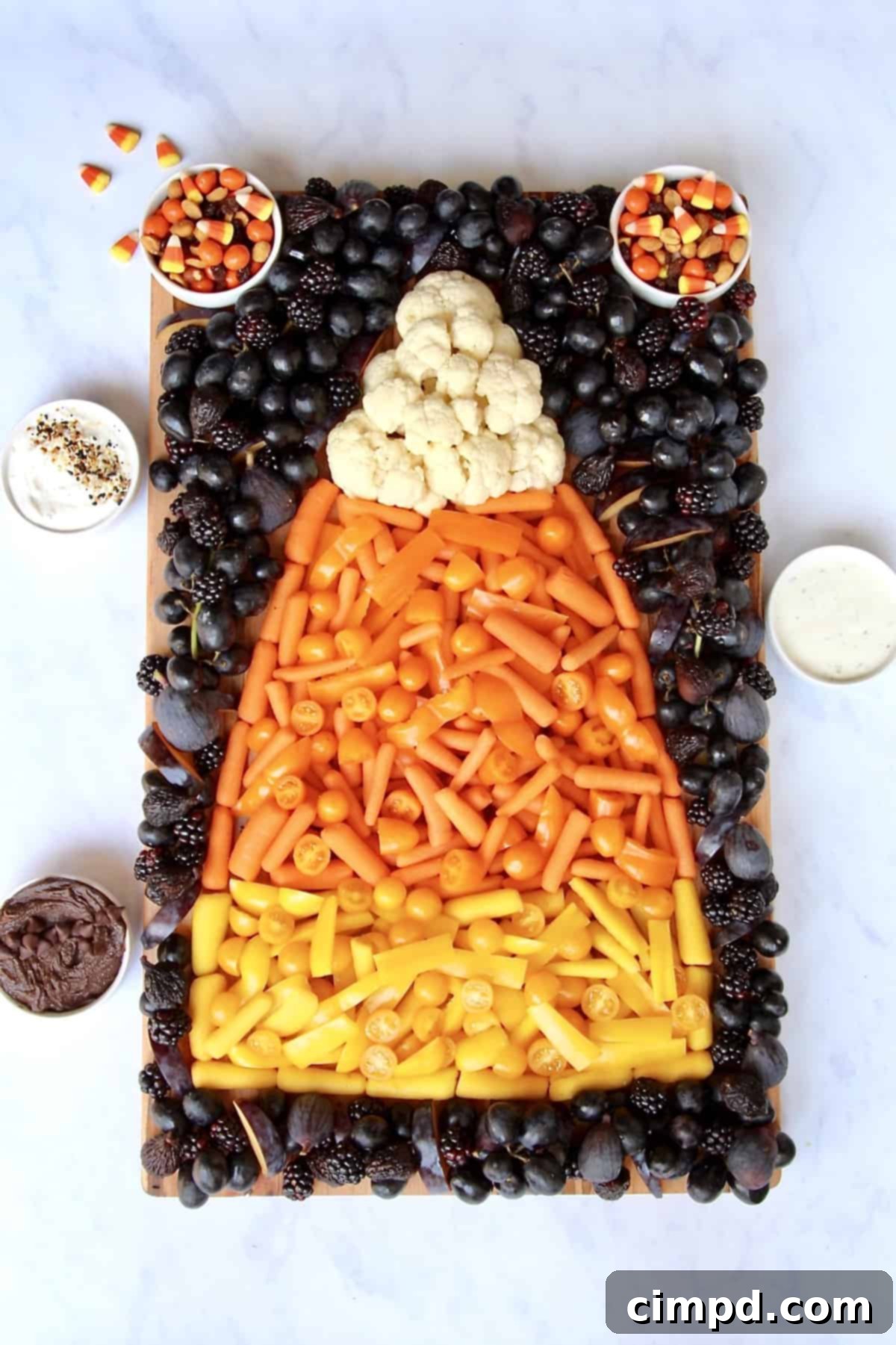 The completed Candy Corn Snack Board, a healthy and festive Halloween appetizer.