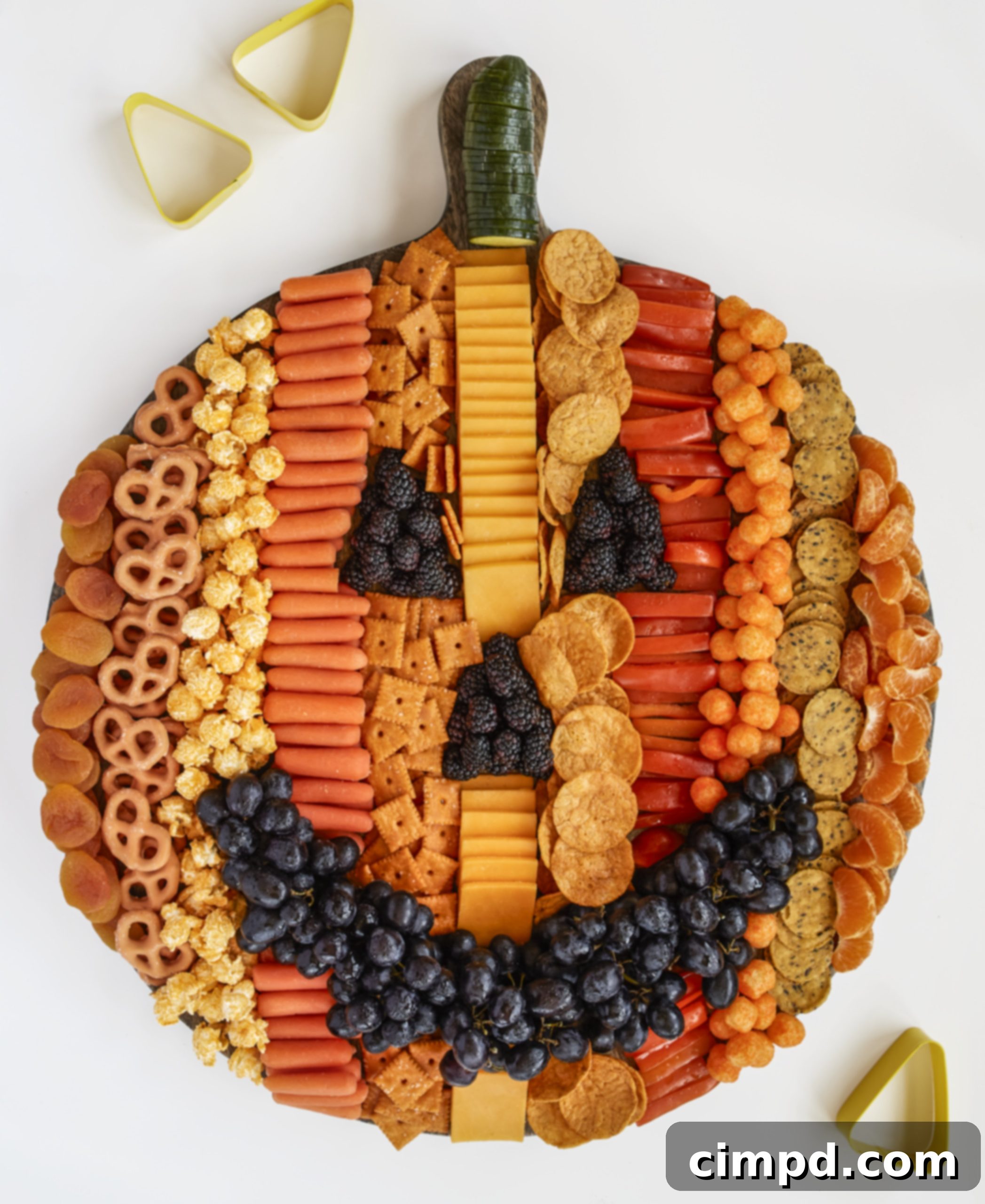 The Ultimate 30 Thanksgiving Dinner Recipes 4 A festive Pumpkin Snack Board by The BakerMama, perfect for fall gatherings.