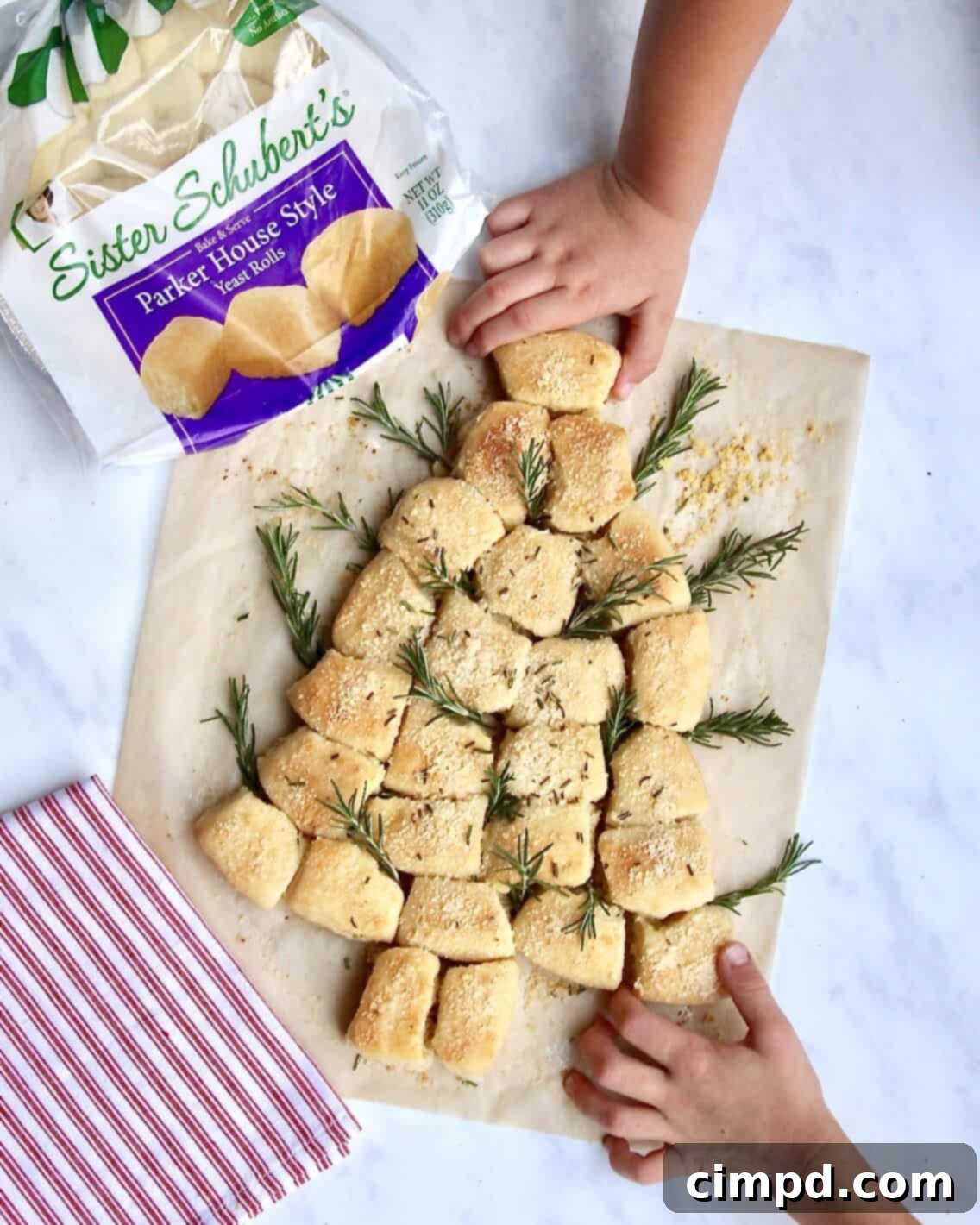 Yuletide Tree Dinner Rolls 4 Ingredients for Christmas Tree Dinner Rolls including defrosted rolls, butter, garlic salt, parmesan, and fresh rosemary