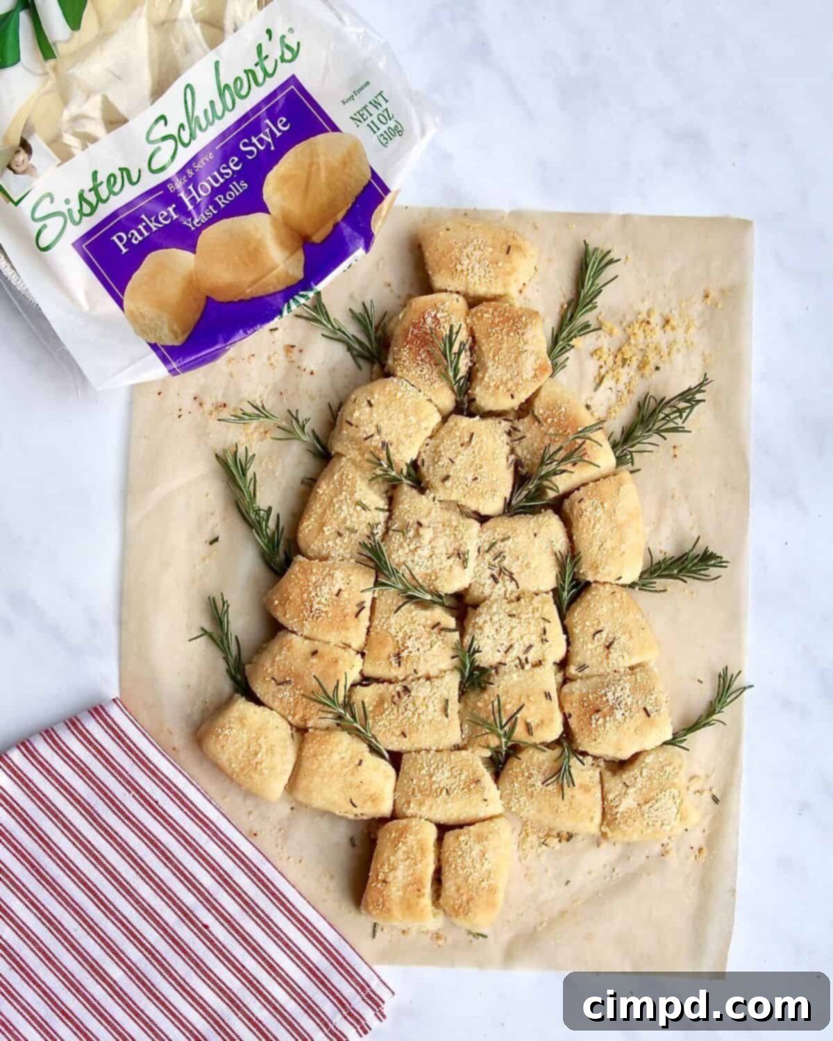 Yuletide Tree Dinner Rolls 7 Baked Christmas Tree Dinner Rolls garnished with fresh rosemary