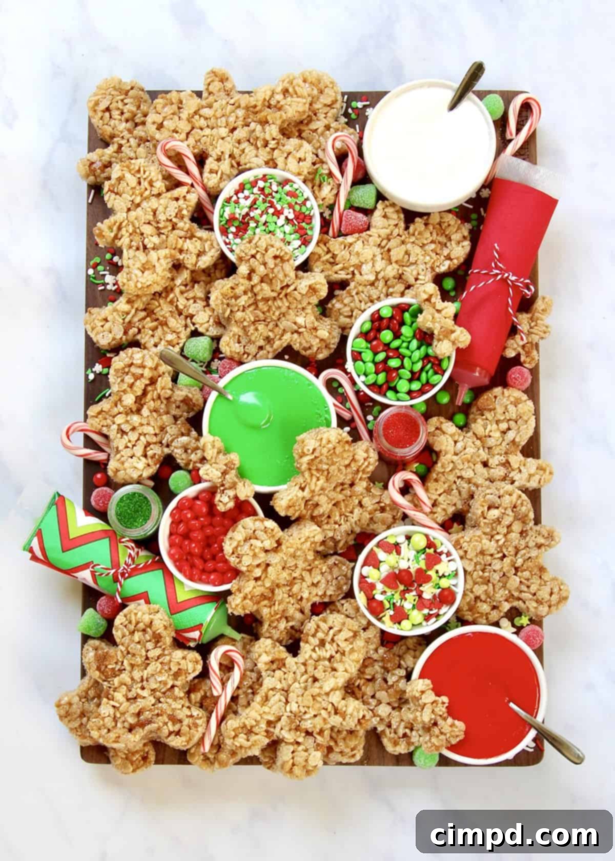 Simple, Festive Holiday Dishes 4 A creative No-Bake Gingerbread Men Decorating Board, set up for a fun holiday activity with various candies and frostings.
