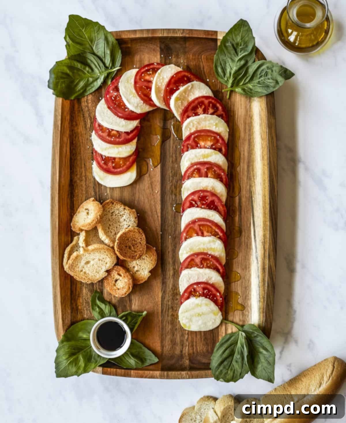 Crimson & Snow Caprese Board 2 Stunning Candy Cane Caprese Board appetizer from The BakerMama's Beautiful Boards Cookbook for holiday entertaining