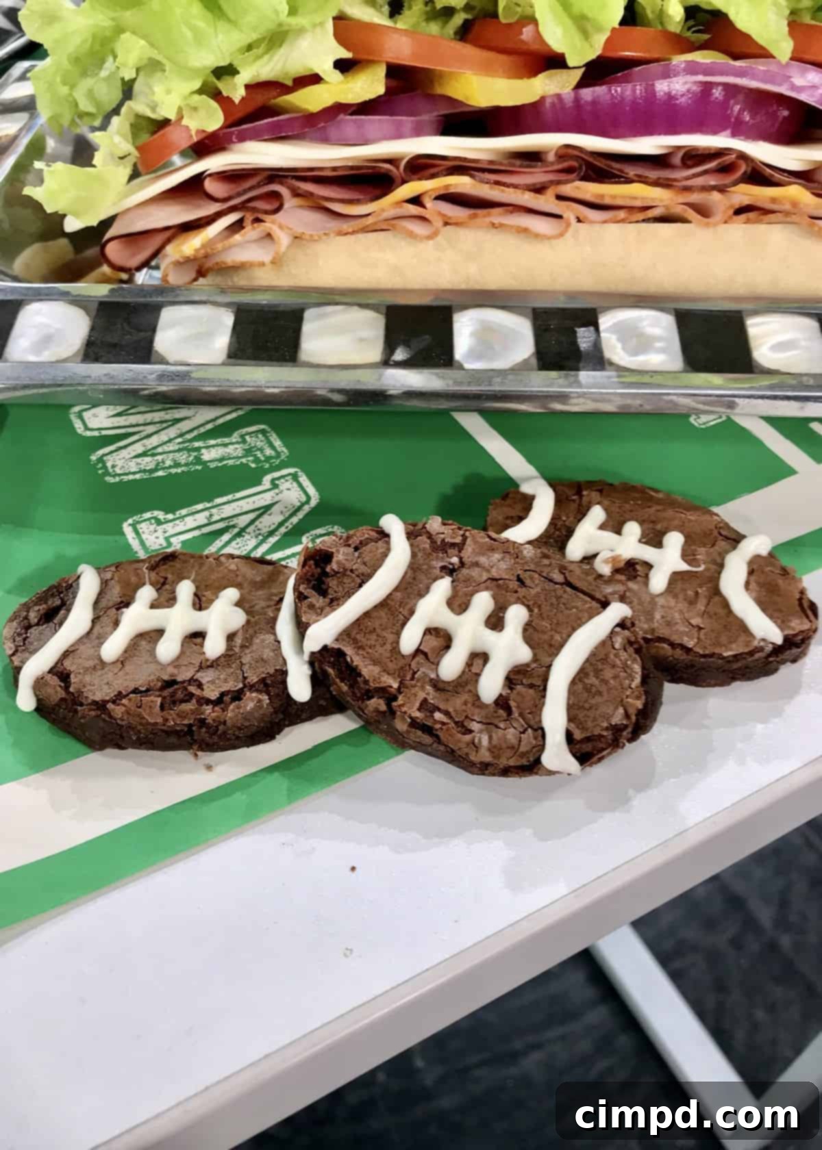 The Ultimate Super Bowl Spread - Delicious football-shaped brownies with white chocolate laces.