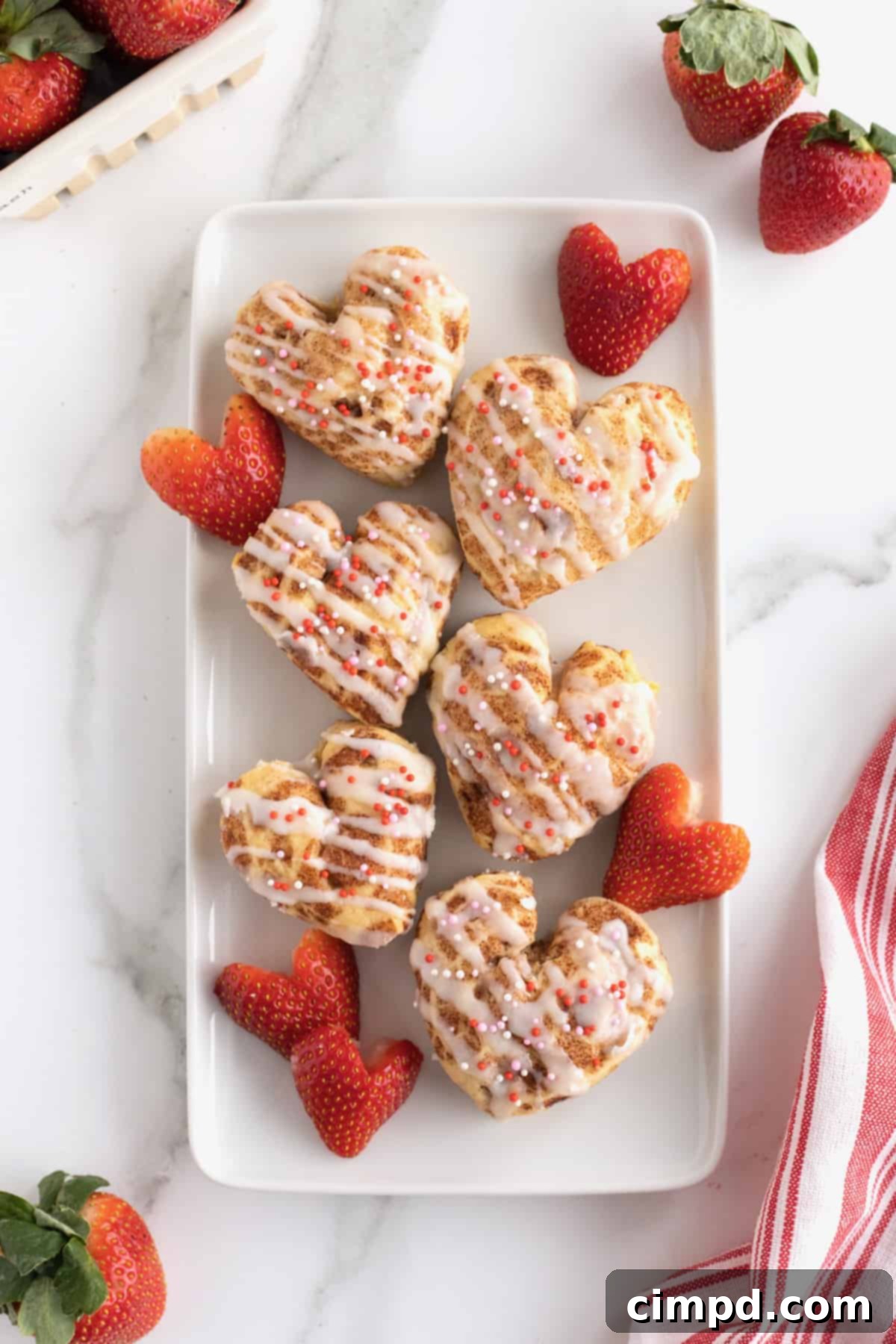 Sweetheart Swirls 2 Delicious heart-shaped cinnamon rolls with icing