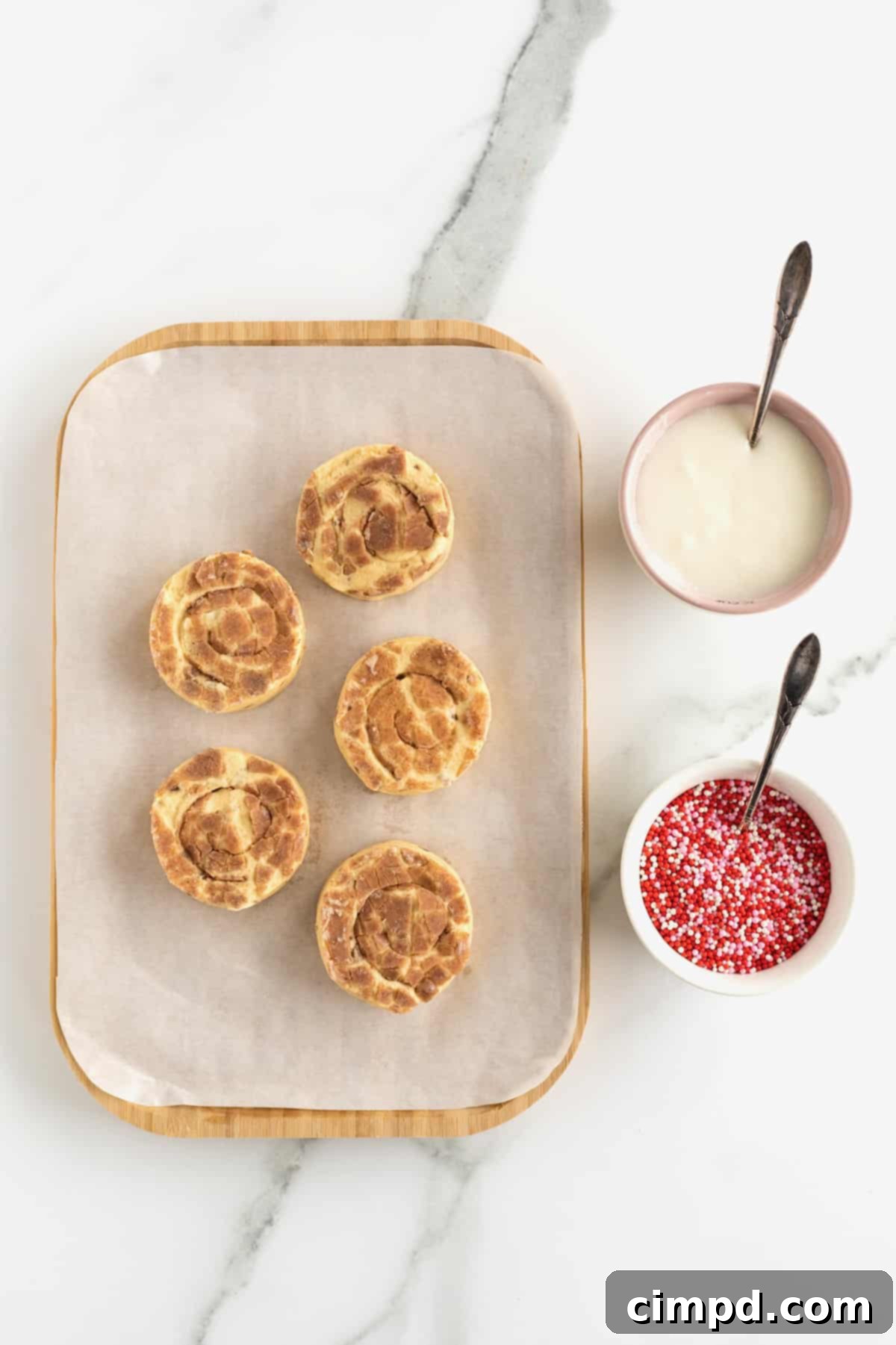 Sweetheart Swirls 5 Ingredients for heart-shaped cinnamon rolls: canned rolls and sprinkles