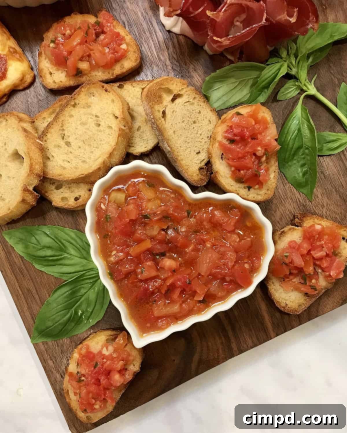 Savoring Love: An Italian Valentine's Dinner Board 8 Fresh Bruschetta, vibrant Pesto, and toasted Baguette slices completing an Italian-themed dinner board