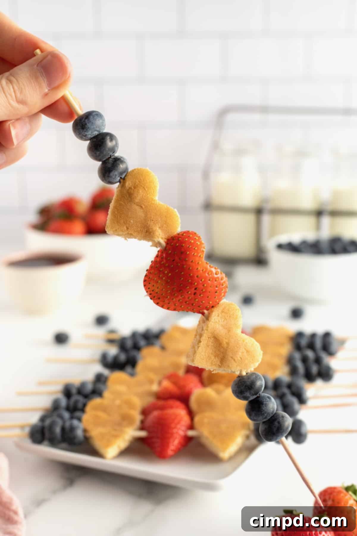 Cupid's Pancake Skewers 3 Close-up of Cupid's Pancake Kabobs on a platter, showcasing heart shapes