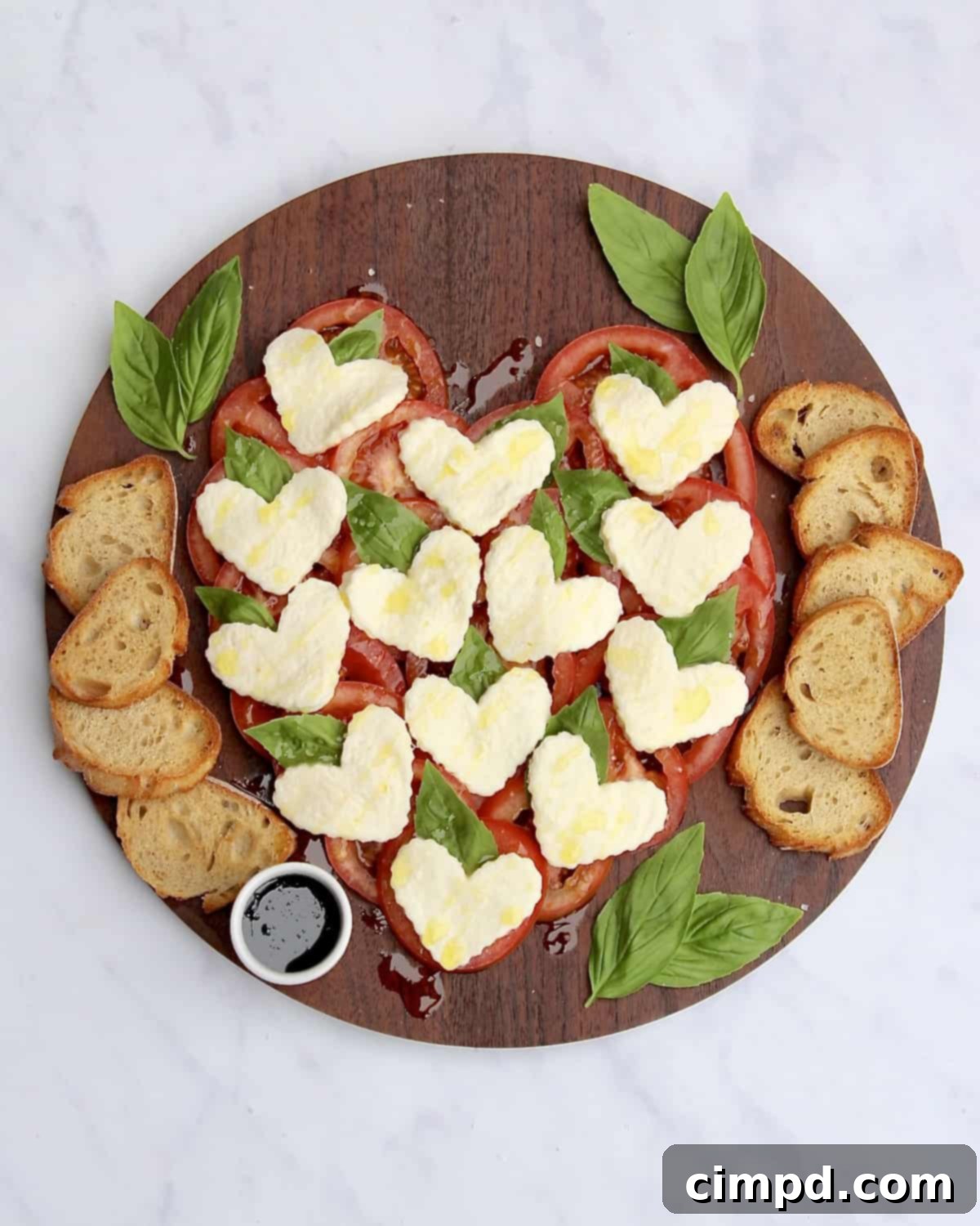 Caprese Hearts 3 Close-up of a Heart Caprese Salad, showcasing the fresh ingredients and intricate arrangement.