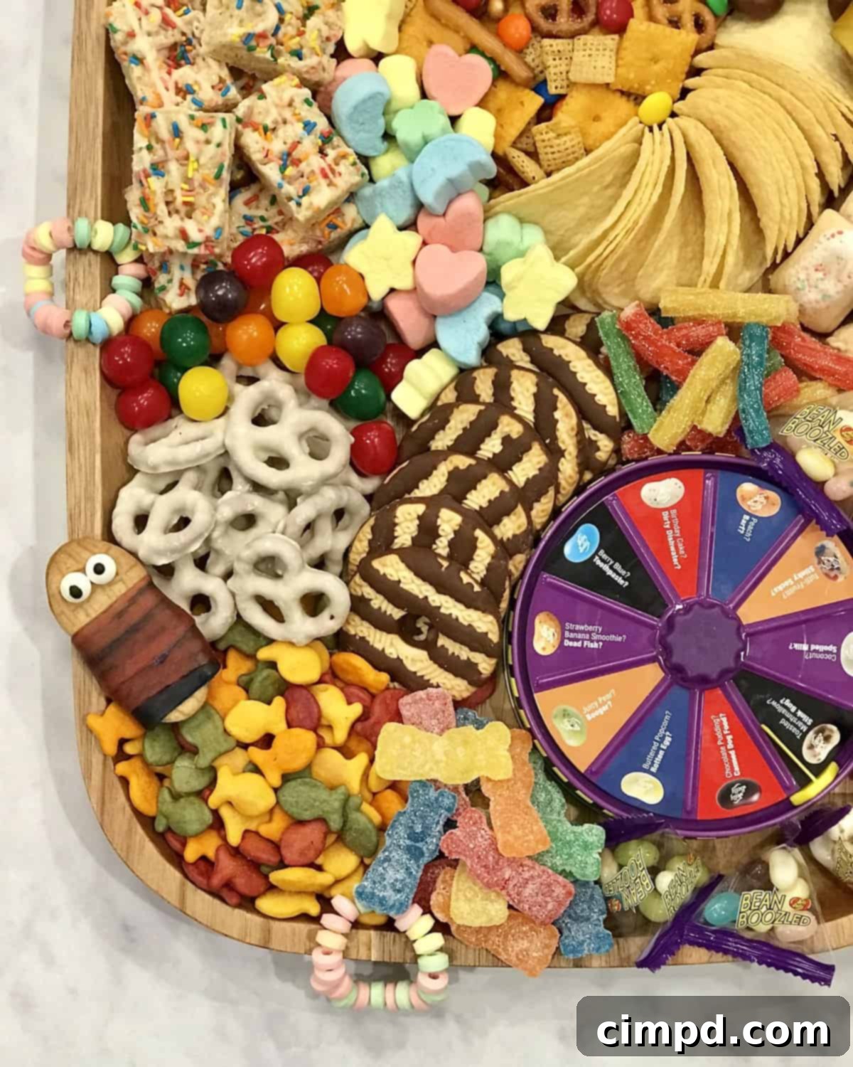 Close-up of the Slumber Party Snack Board, highlighting colorful candies, crispy snacks, and the Bean Boozled game box as the centerpiece.