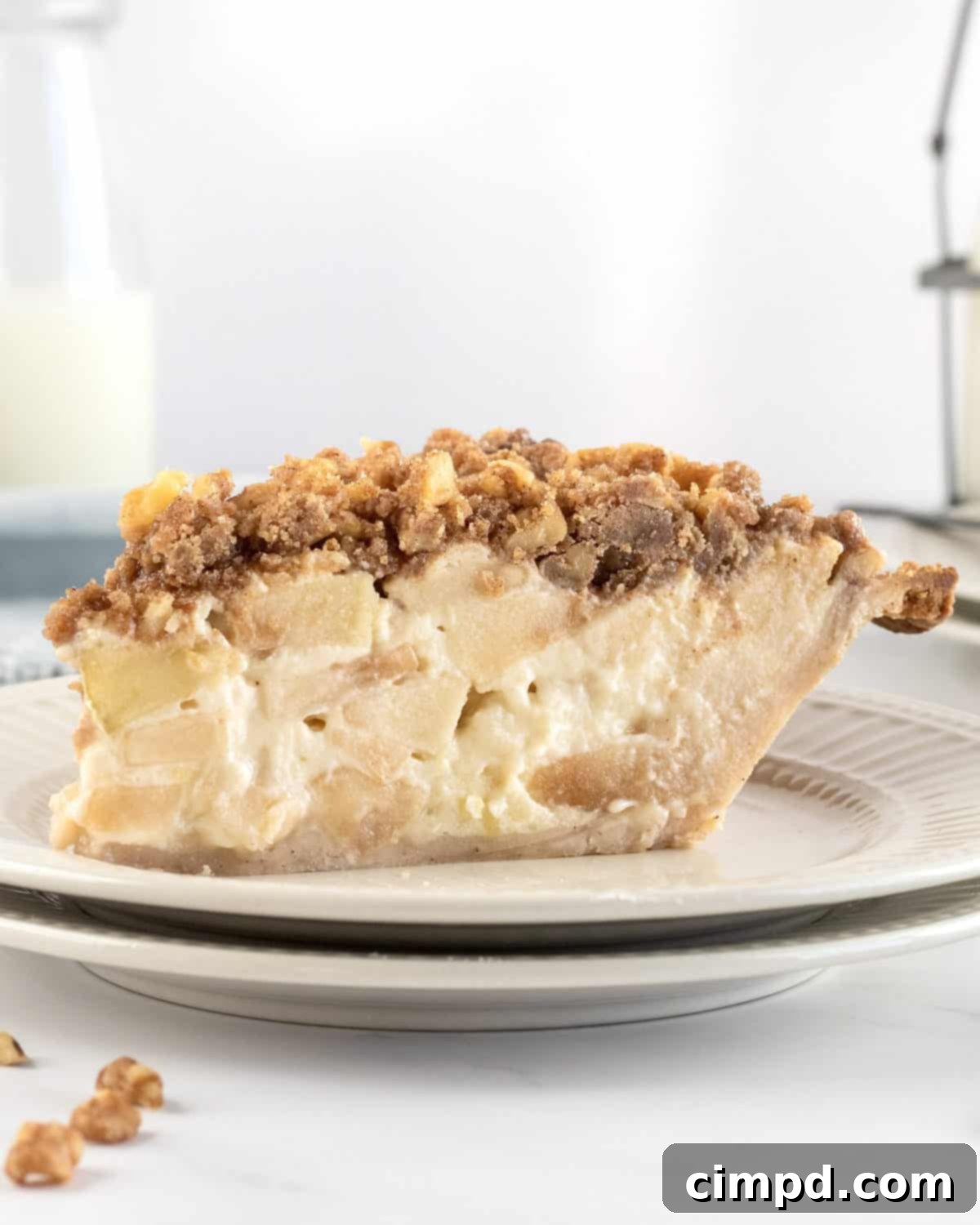 Mom's Signature Apple Pie 10 A slice of Mom's Special Apple Pie with a scoop of vanilla ice cream, ready to be enjoyed.