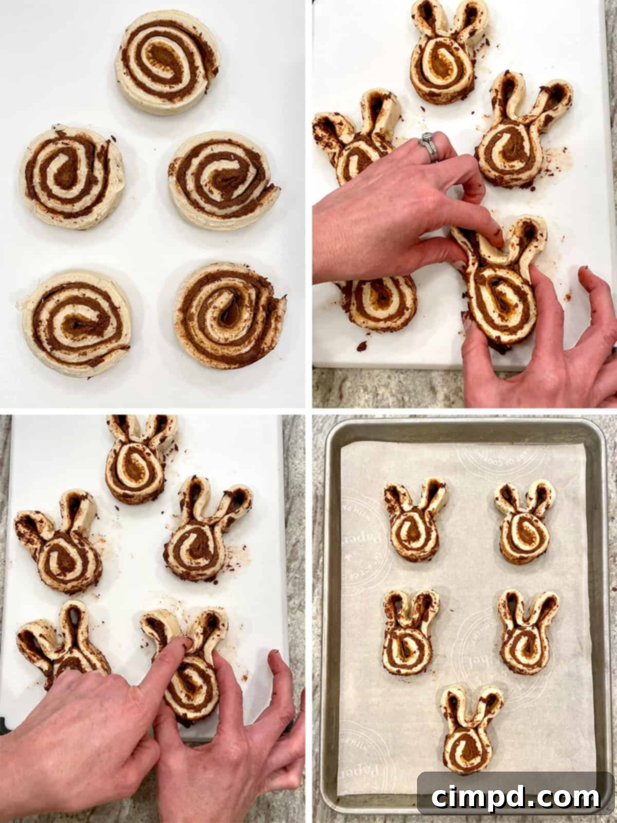 Hoppy Easter Cinnamon Swirls 5 Unbaked cinnamon rolls shaped into bunnies on a baking sheet