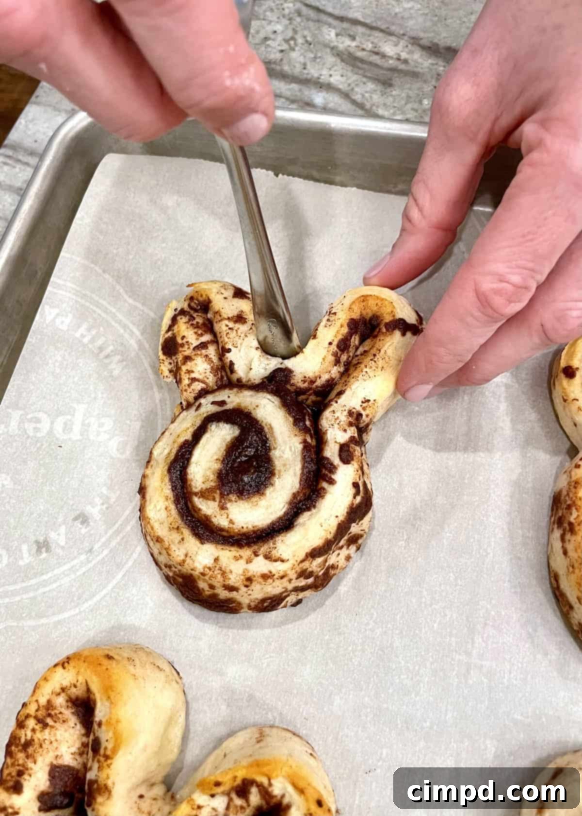 Hoppy Easter Cinnamon Swirls 6 Cinnamon rolls halfway baked, ready for reshaping