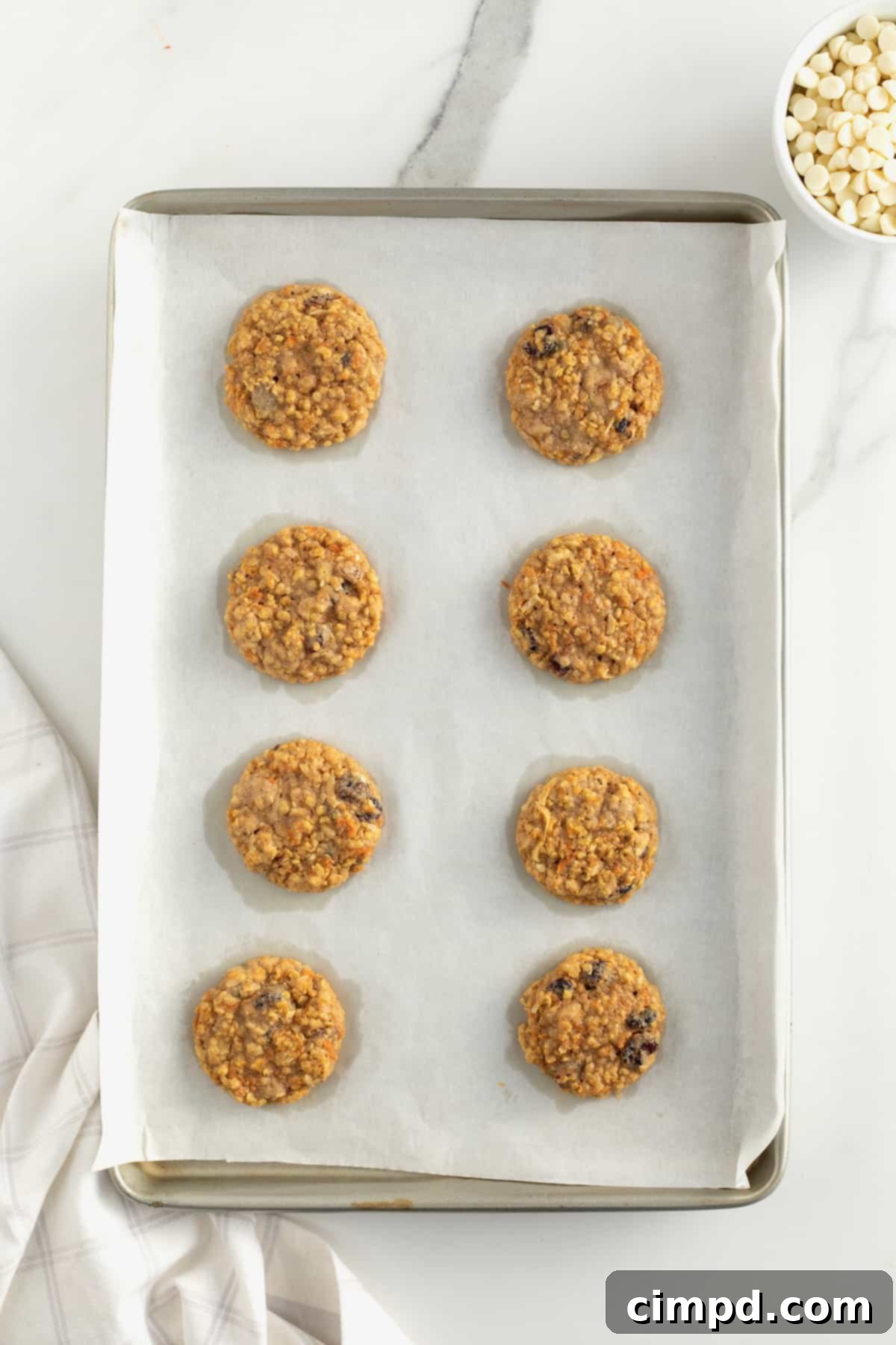 Freshly baked Carrot Cake Cookies by The BakerMama cooling on baking sheet