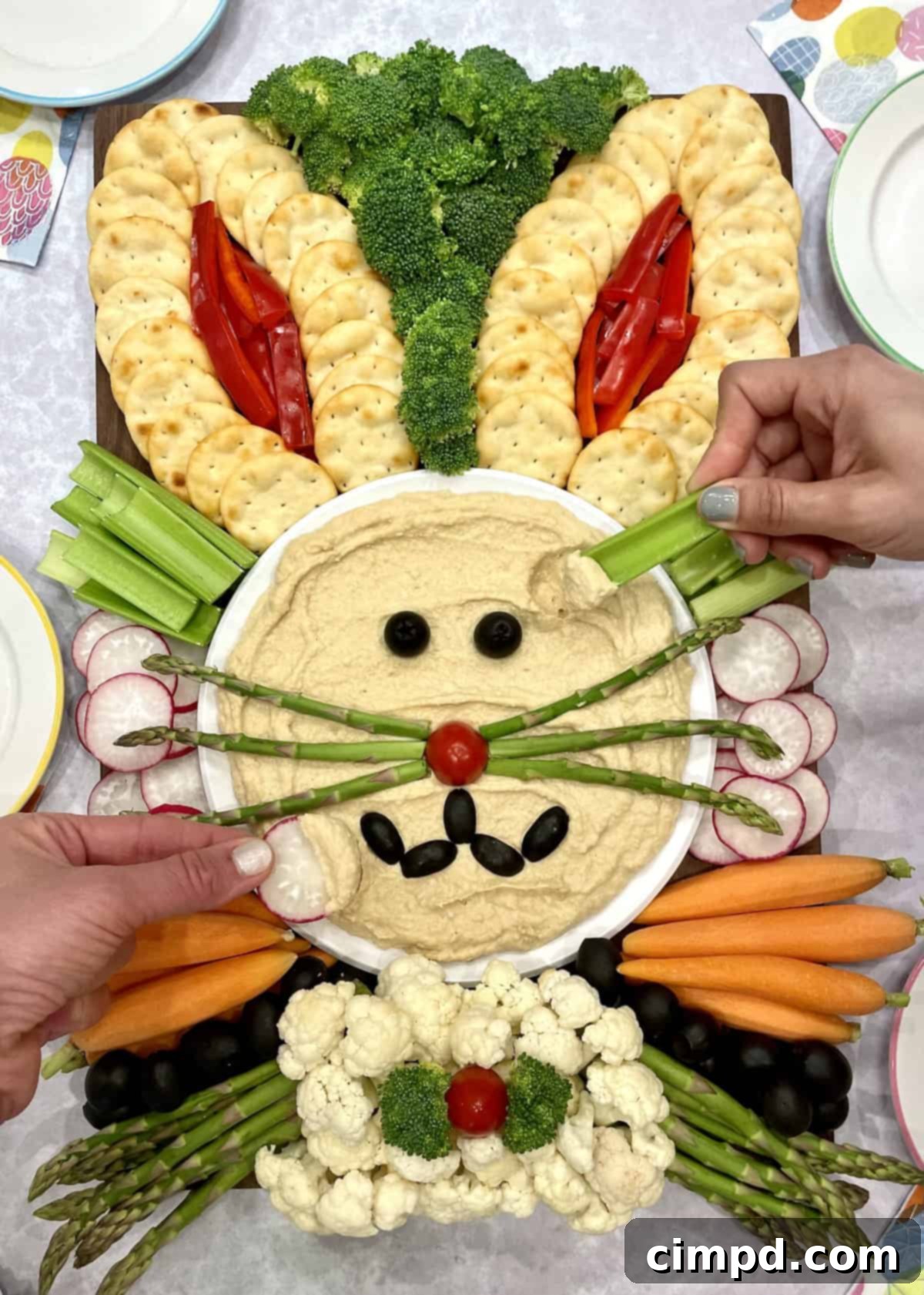 Family enjoying the process of assembling an Easter Bunny Snack Board