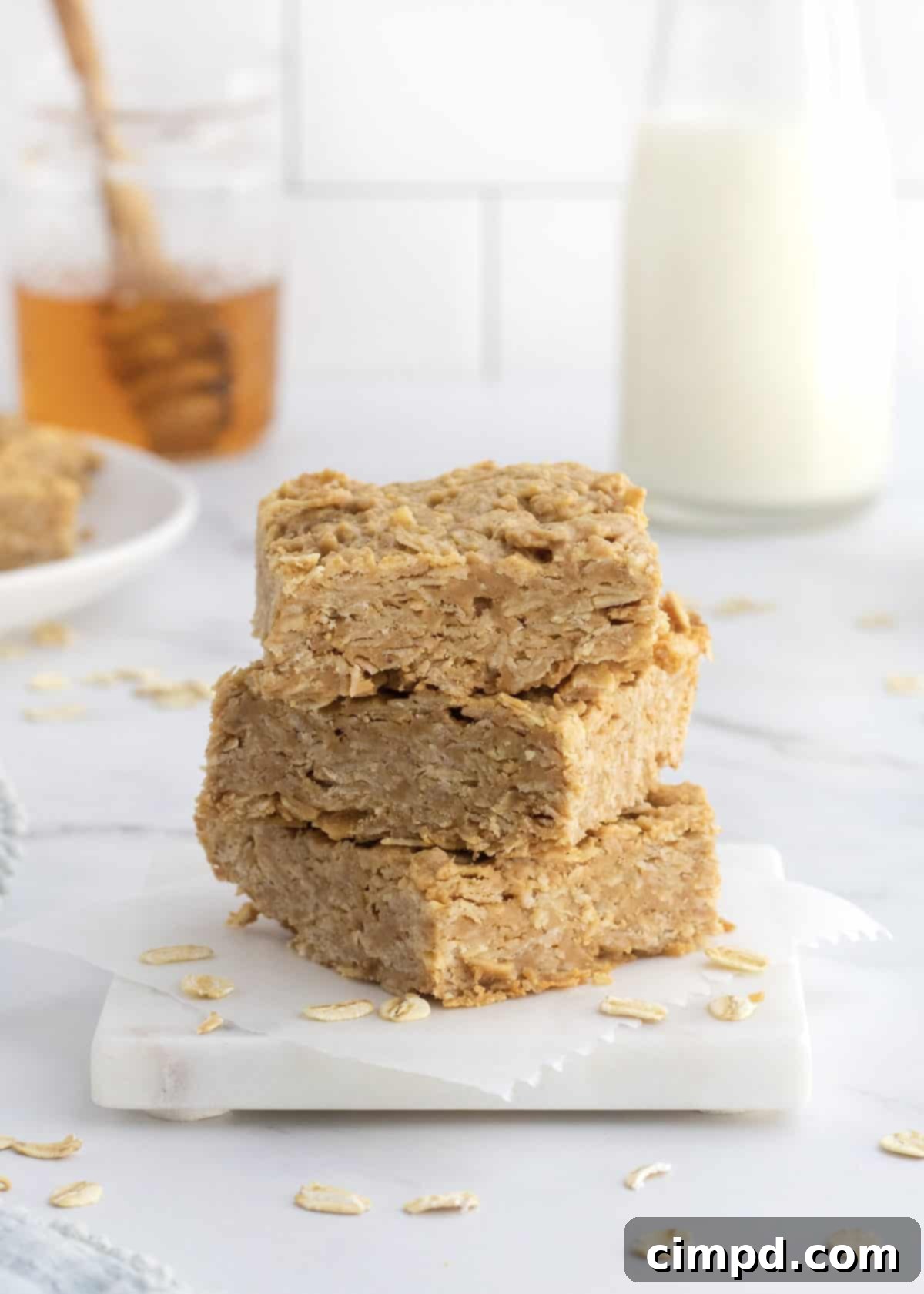 Delicious and healthy 3-Ingredient Peanut Butter Honey Oat Bars, freshly baked and ready to eat.