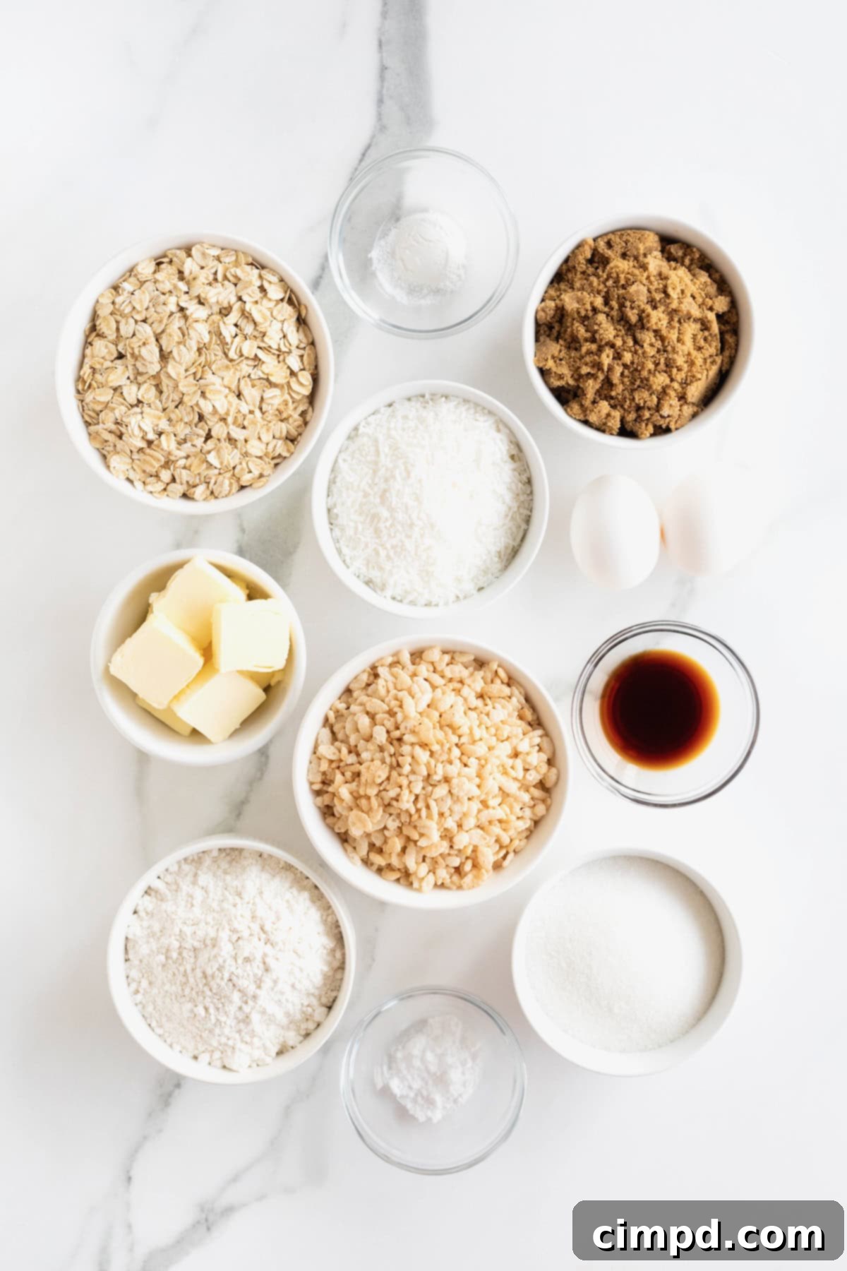 Spiced October Treats 5 All the dry and wet ingredients for October Cookies neatly arranged in small glass dishes on a white marble counter, ready for baking.