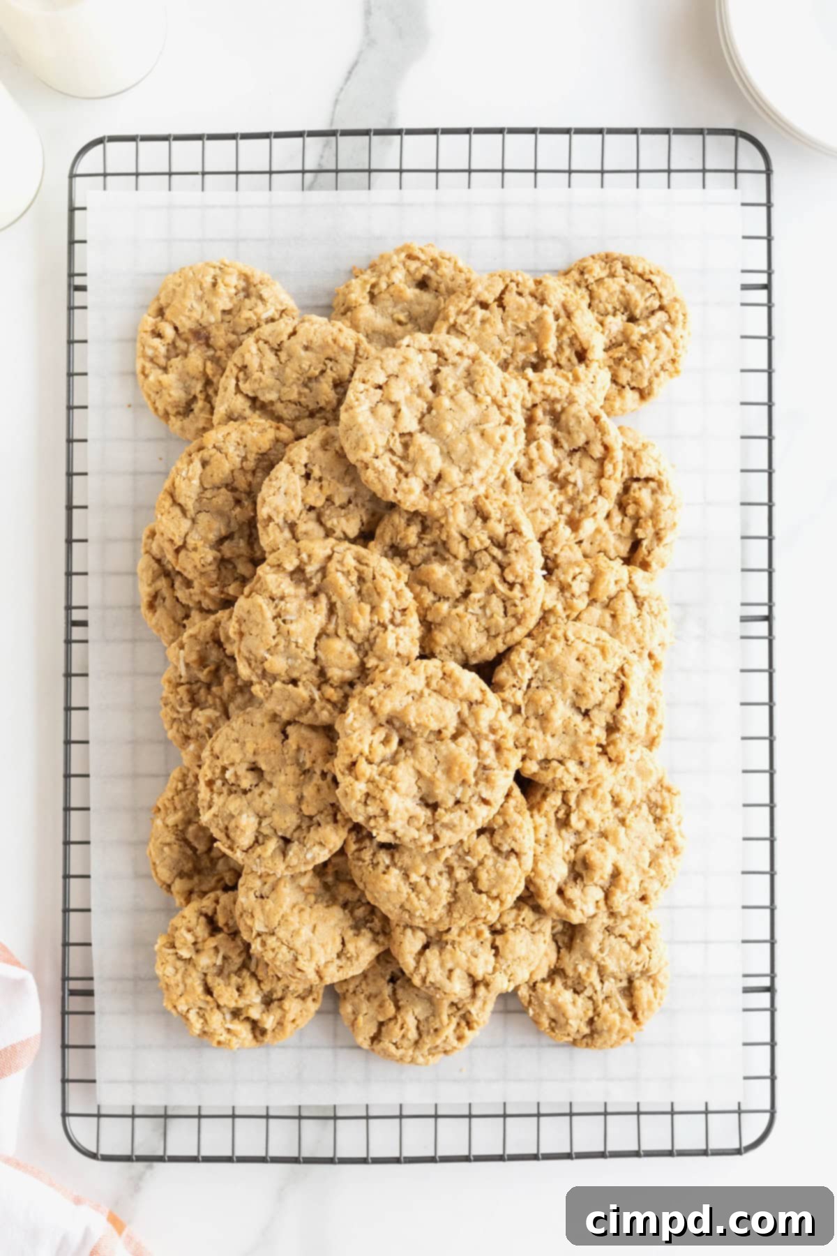 Spiced October Treats 9 A generous pile of October Cookies stacked on a parchment lined metal cooling rack, ready for storage or serving.