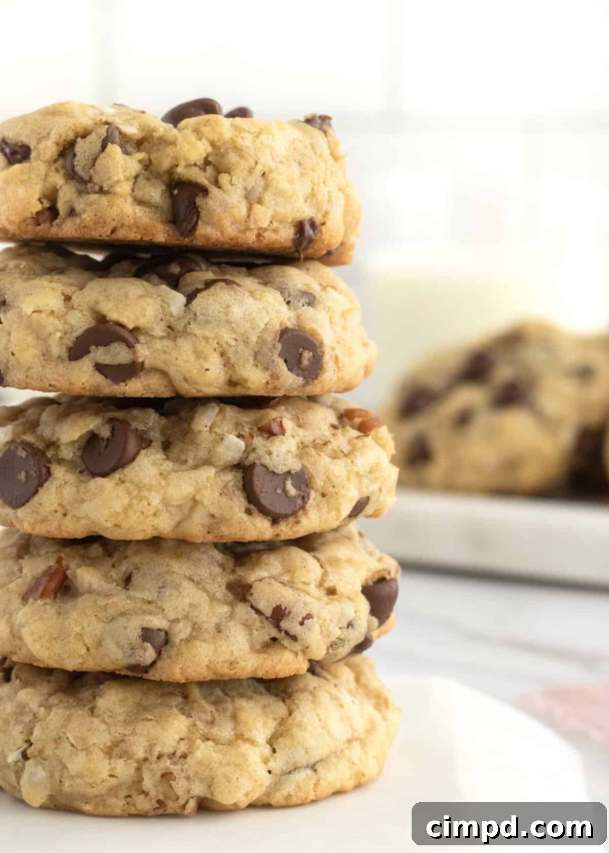 Delicious Coconut Pecan Chocolate Chip Oatmeal Cookies on a baking sheet, showcasing their texture