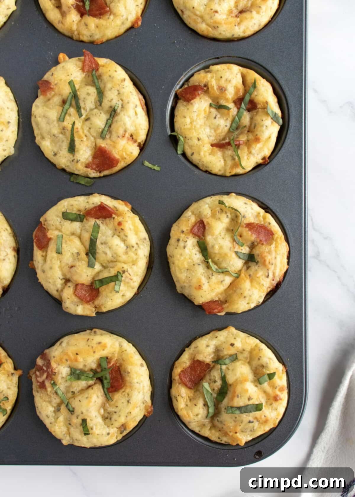 Cheesy Pizza Poppers 6 Freshly Baked Pizza Muffins on a Cooling Rack