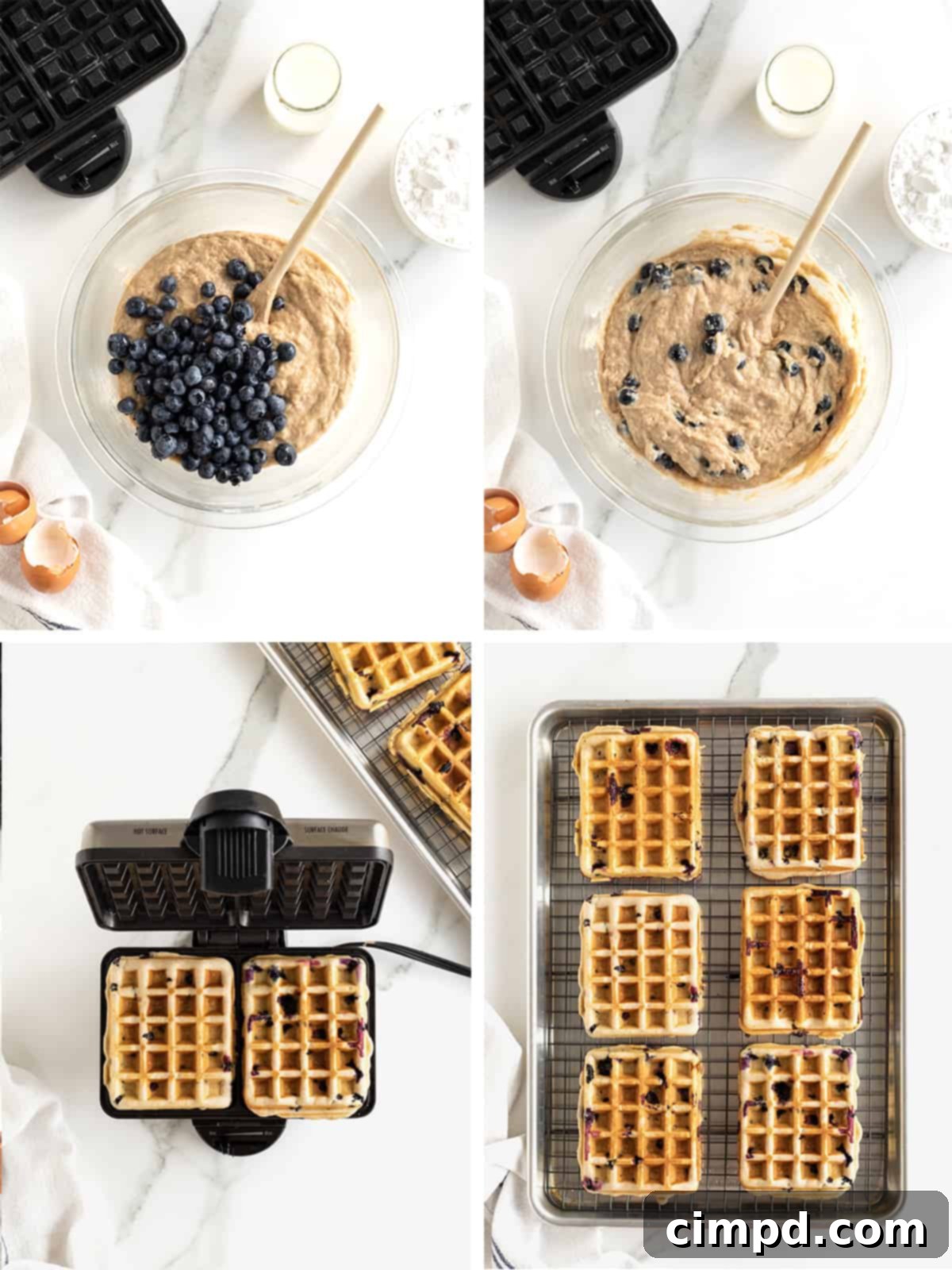The continuation of the waffle making process, showing blueberries folded into batter and waffles cooking in the iron.