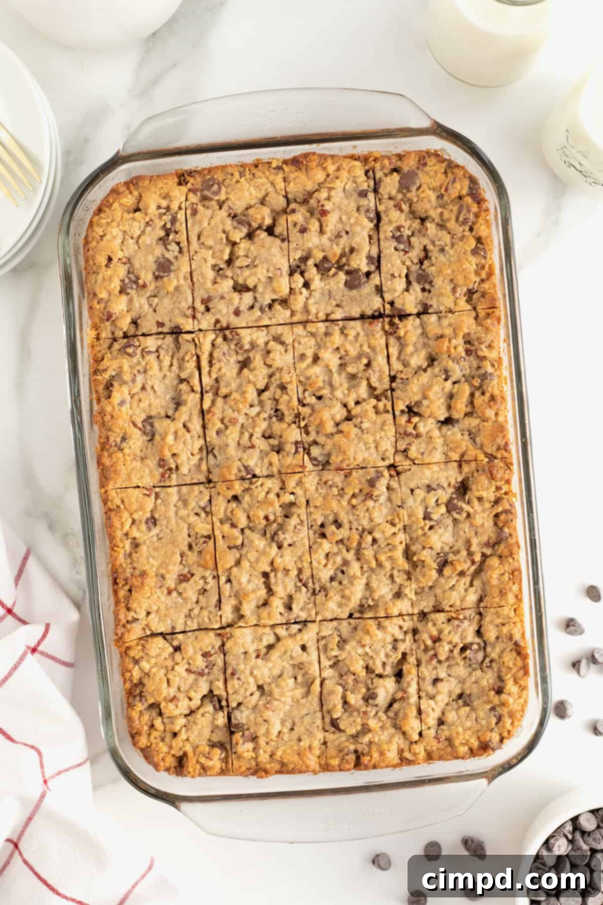 Homemade Chocolate Chip Granola Bars 11 A glass baking dish of granola bars cut into pieces.