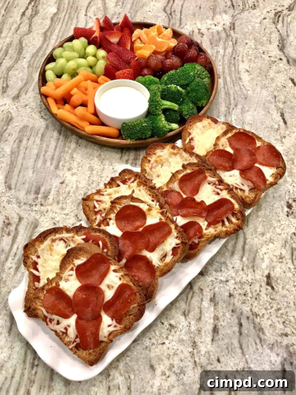 Pizza Toast with a fresh fruit and veggie board.