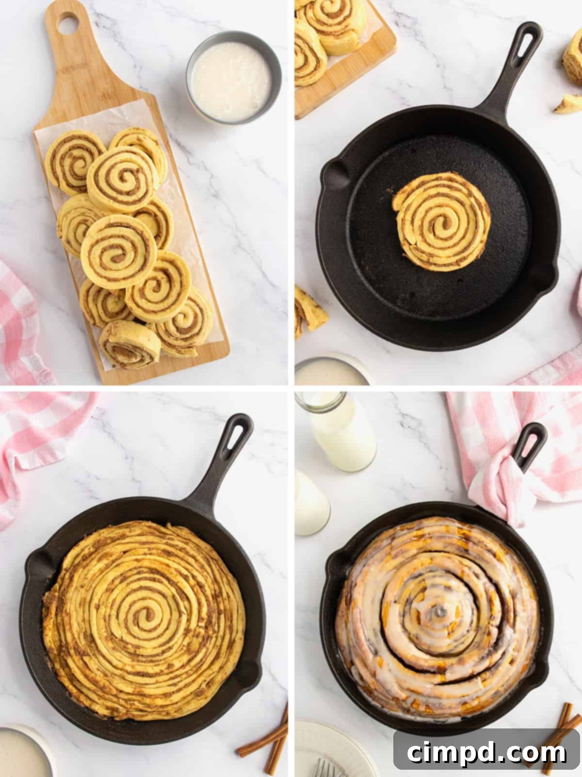 Freshly baked giant cinnamon roll in a skillet, generously drizzled with sweet white icing