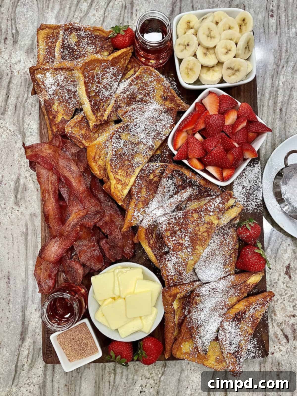 The Ultimate French Toast Brunch Board 2 A beautifully arranged French Toast Board with various toppings and golden French toast slices