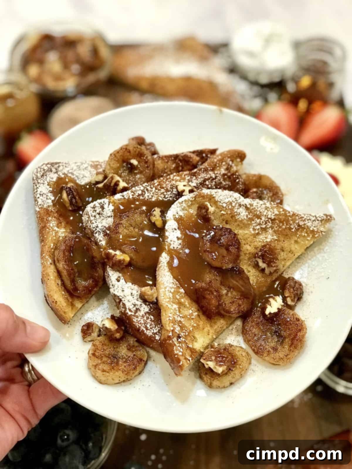 The Ultimate French Toast Brunch Board 7 A fully assembled French Toast Board with crispy bacon and various fruit toppings