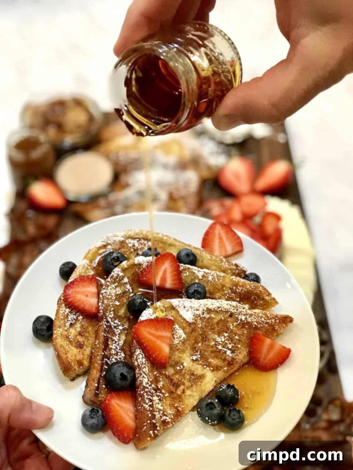 The Ultimate French Toast Brunch Board 8 Detailed overhead view of a French Toast Board with toppings, bacon, and neatly arranged French toast