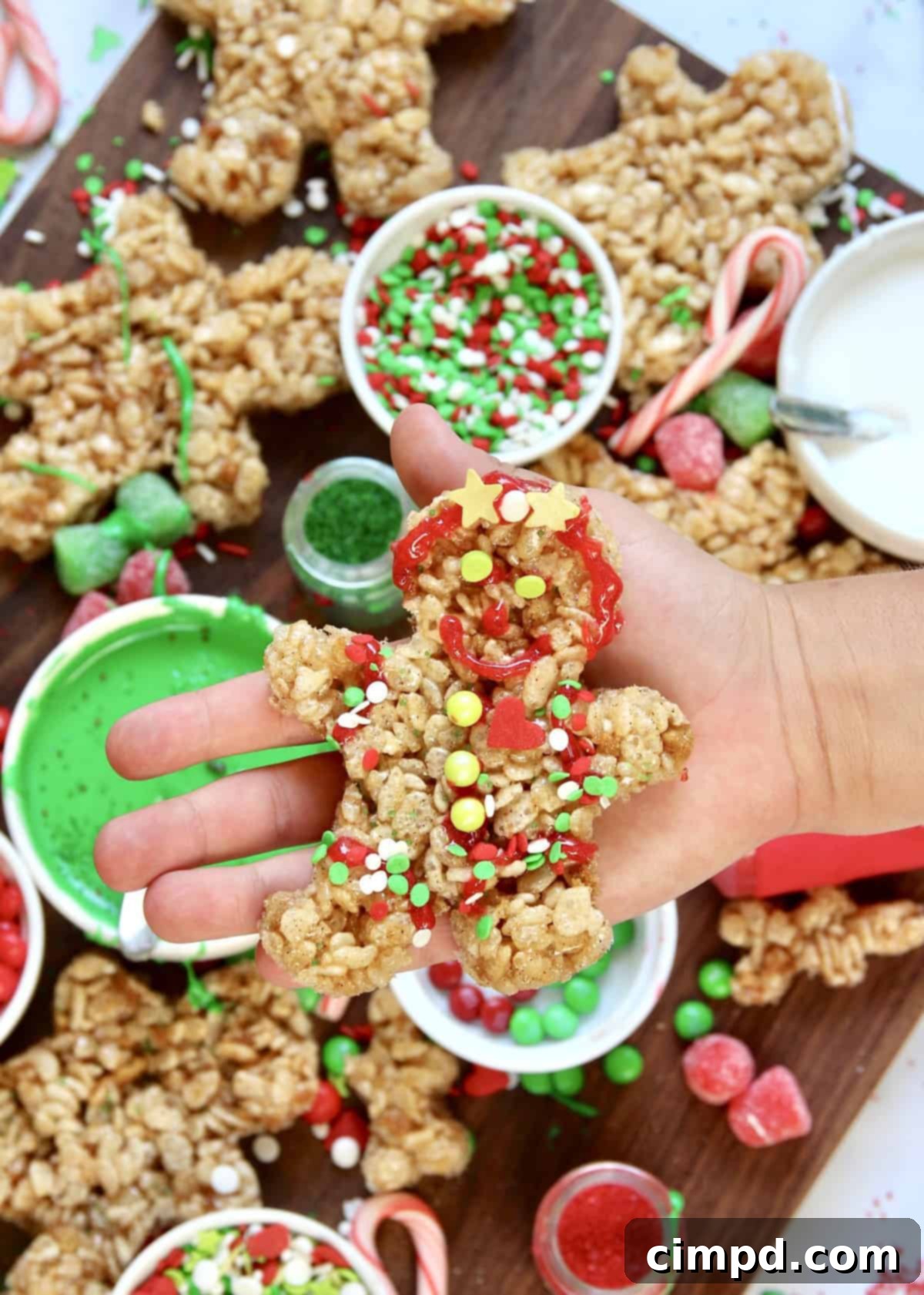 Several decorated no-bake gingerbread men on a board, showing various designs.