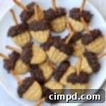 Autumn Delights Platter 11 Nutter Butter Acorns on Fall Feast Board by The BakerMama