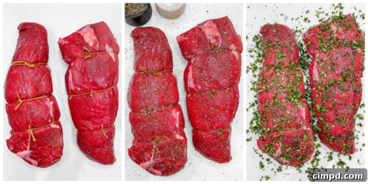 Uncooked beef tenderloin roasts seasoned with fresh herbs and spices