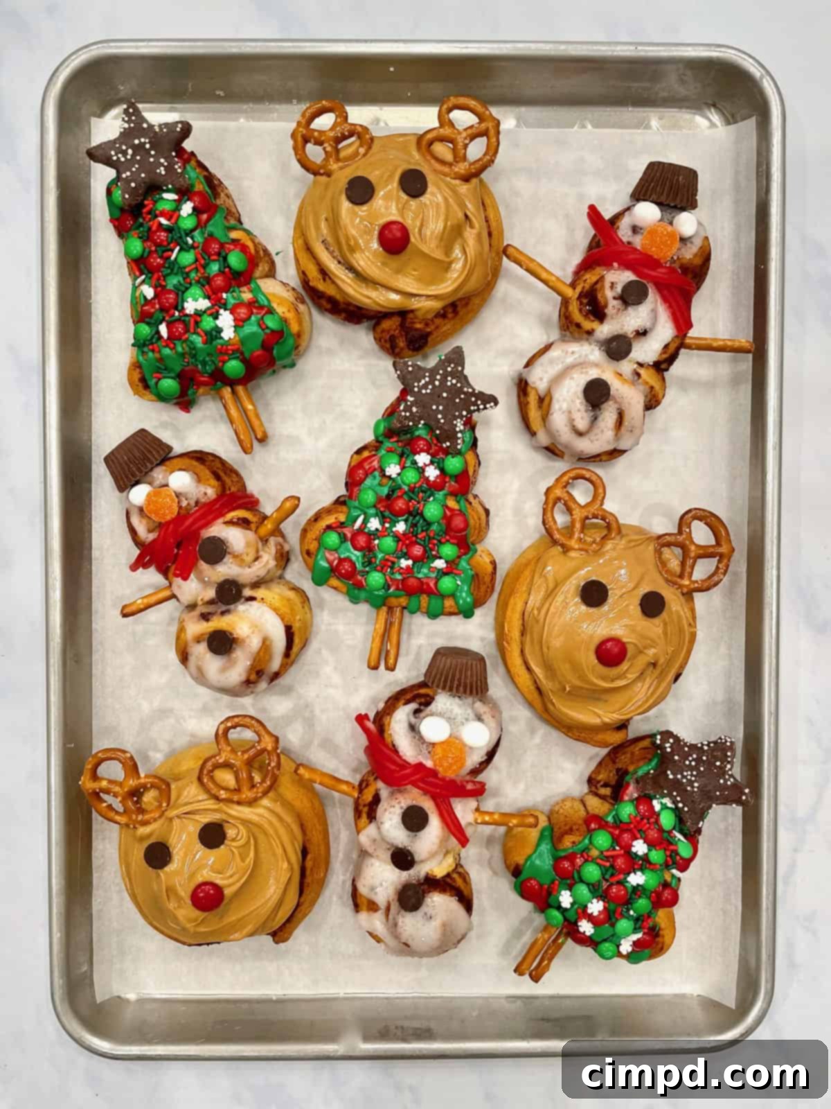 An array of Festive Christmas-Shaped Cinnamon Rolls, beautifully glazed and arranged to showcase their holiday forms, perfect for a special breakfast.