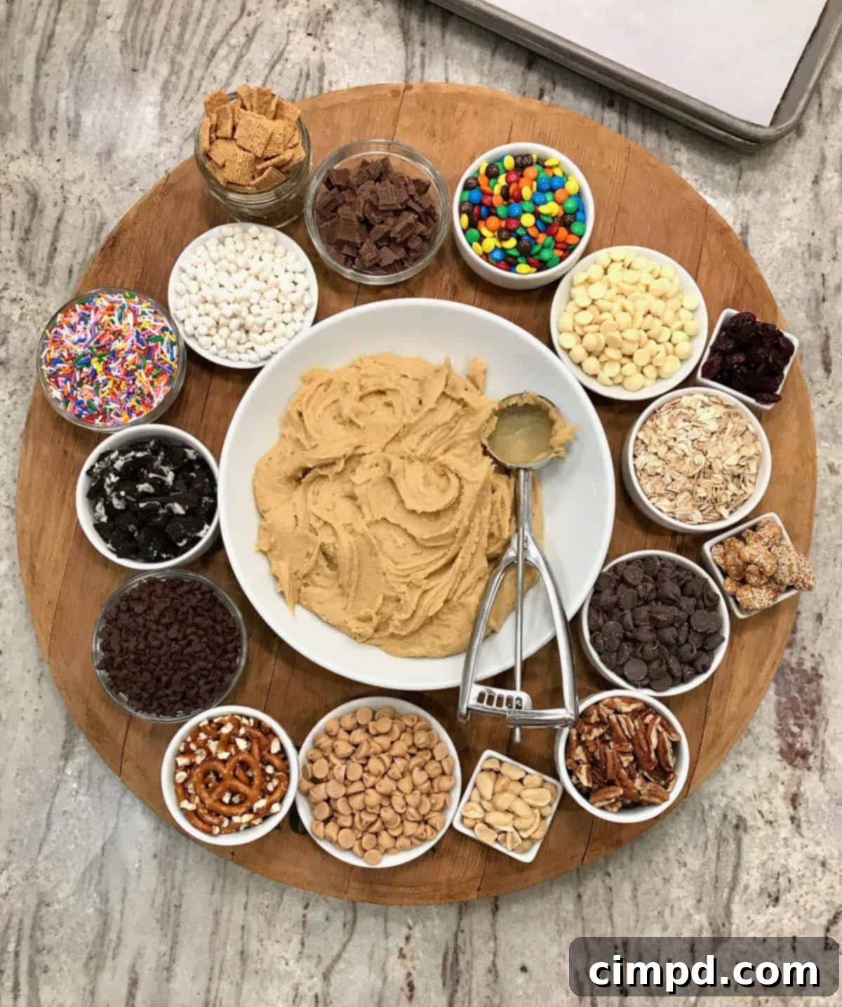 Craft Your Own Cookie Magic 3 Close-up of hands mixing colorful sprinkles into cookie dough