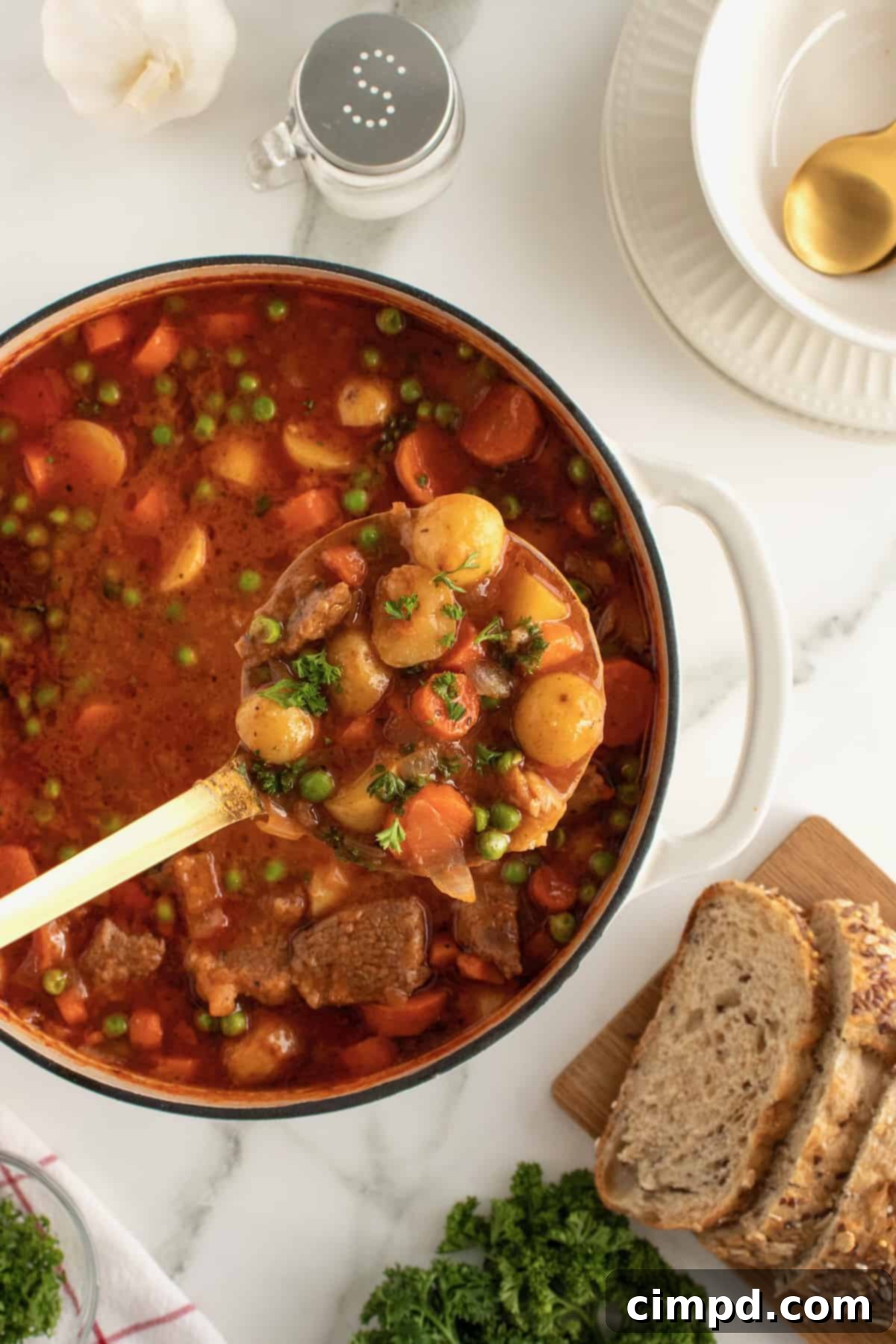 Various side dishes to serve with beef stew, including biscuits and bread.