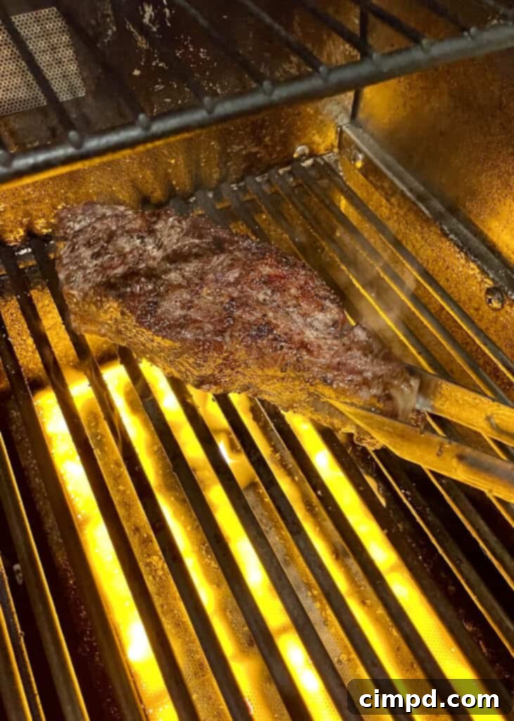 How to Reverse Sear a Steak: steak searing on high heat grill