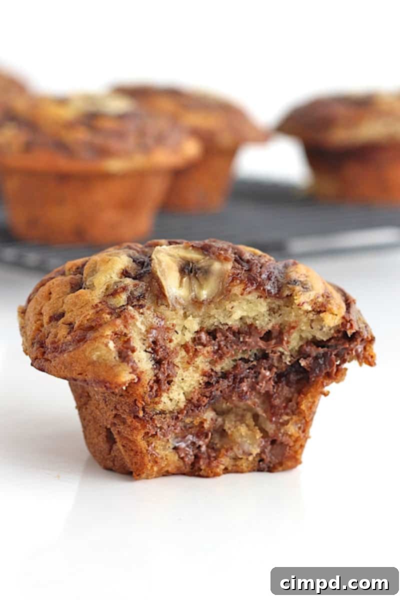 Moist Nutella Swirled Banana Muffins, a delightful breakfast or snack.