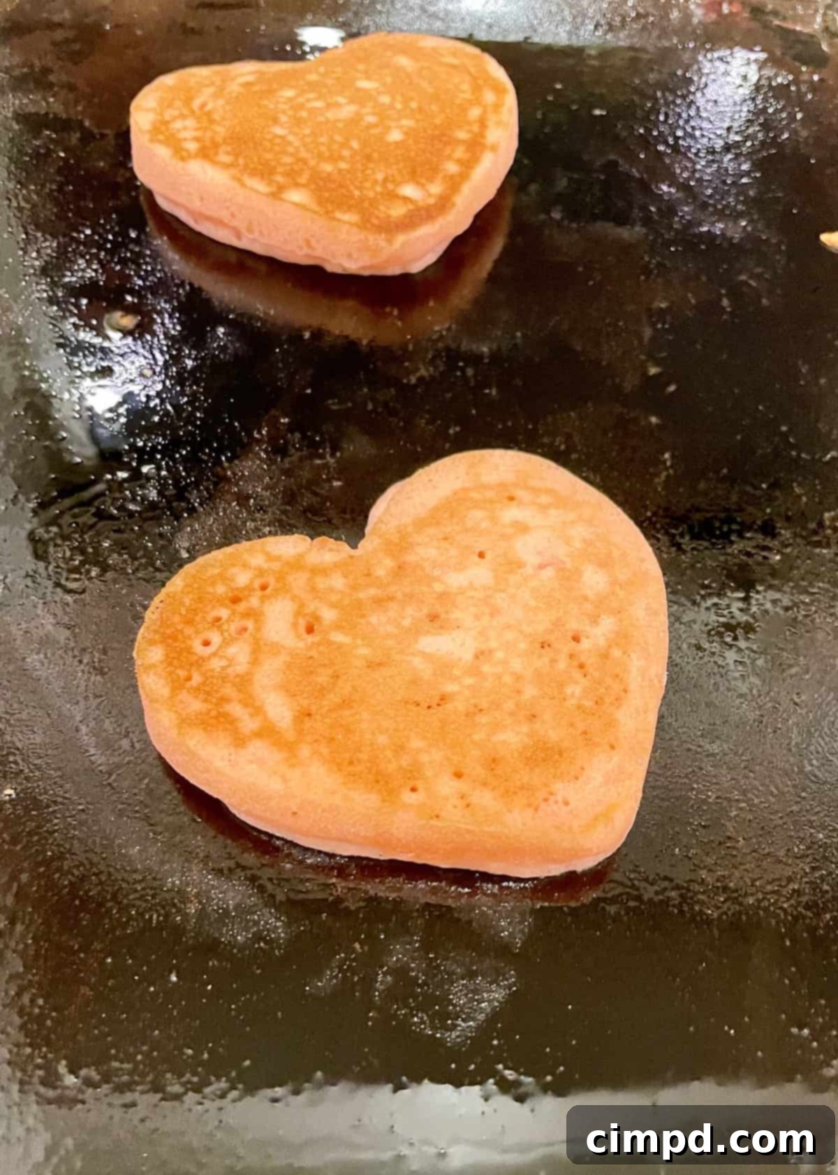 Love Day Pancake Brunch Board 7 A collection of perfectly cooked heart-shaped pancakes ready for the Valentine's Day Pancake Board.